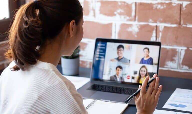 Young Asian businesswoman work at home and virtual video conference meeting with colleagues business people, online working, video call